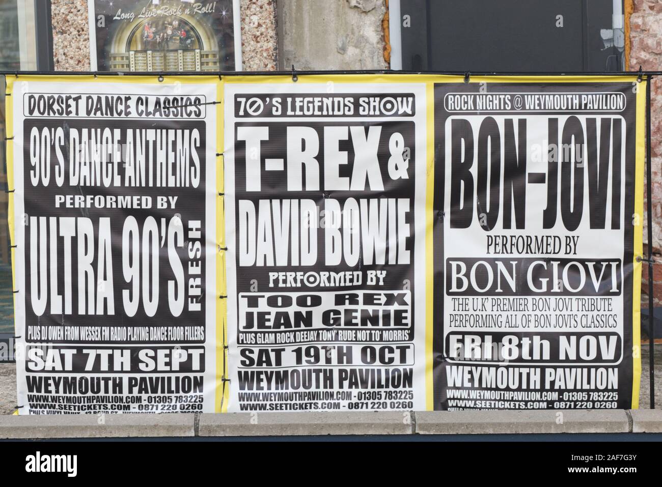 weymouth pavilion posters advertising ultra 90's, T Rex and David Bowie, bon jovi, tribute bands Stock Photo