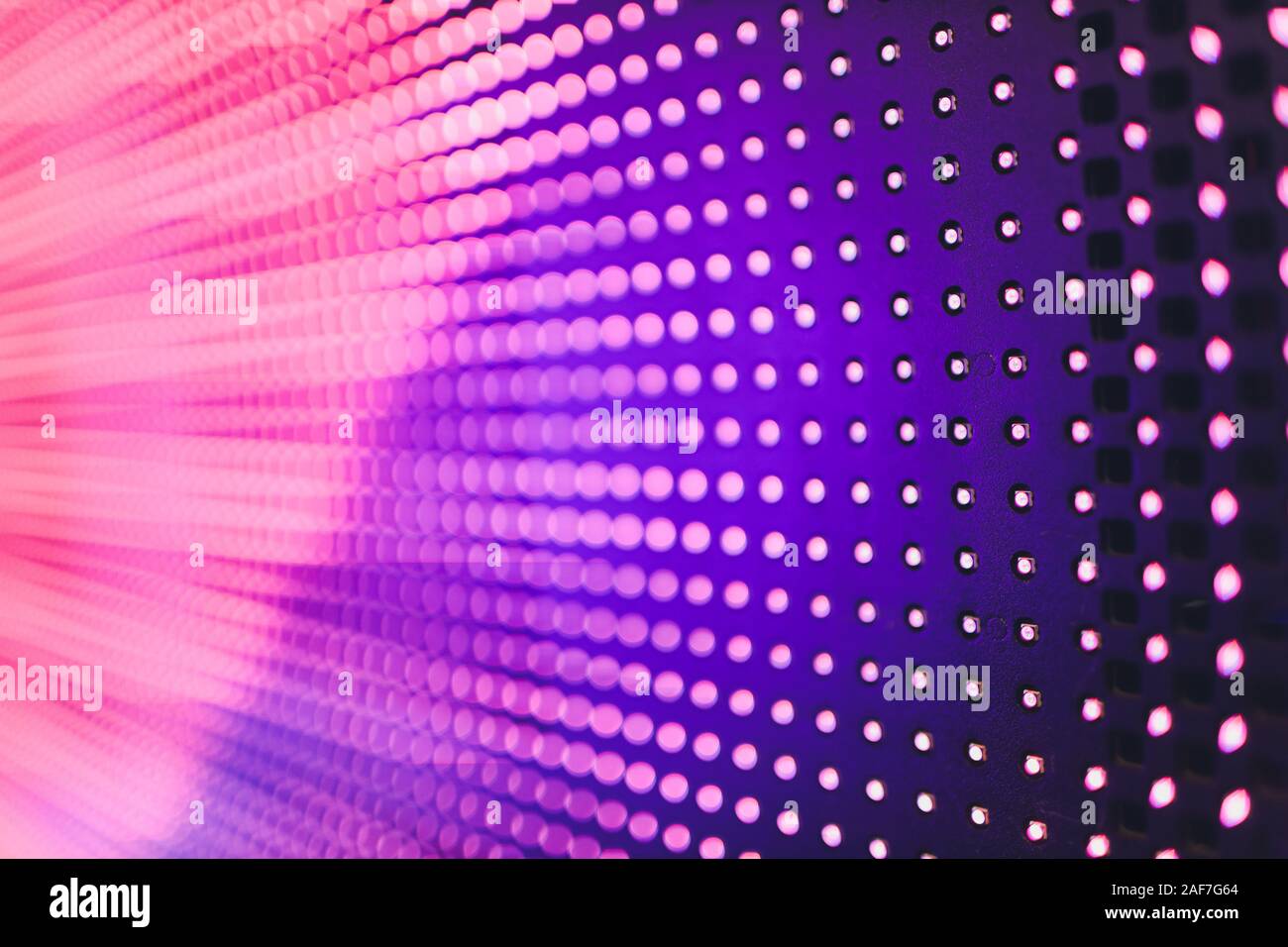 Bright colored blue LED wall with pink pattern - close up background Stock Photo