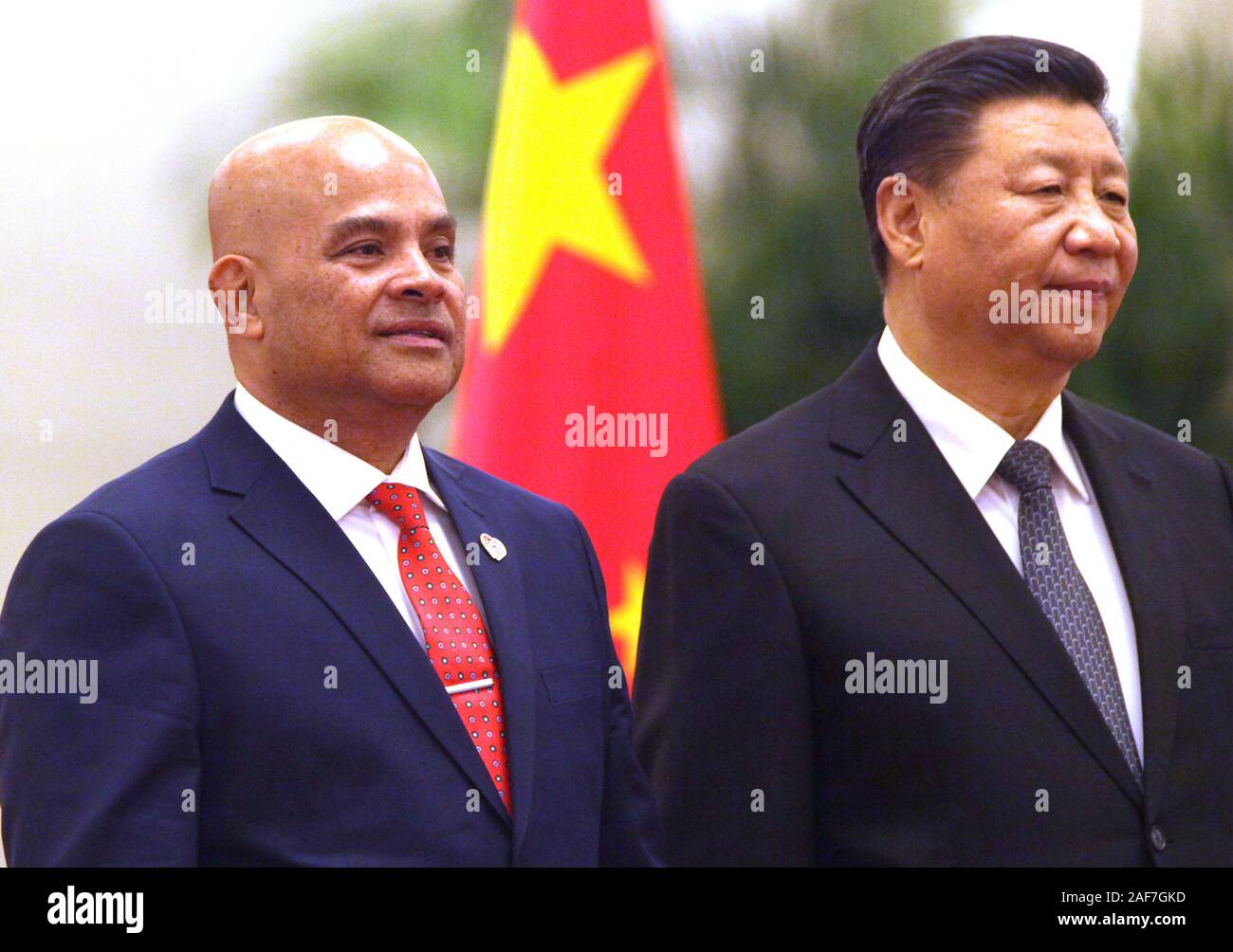 Beijing, China. 13th Dec, 2019. Micronesian President David Panuelo (L) and Chinese President Xi Jinping attend a welcoming ceremony at the Great Hall of the People in Beijing on Friday, December 13, 2019. Paneulo's visit to China highlights Beijing's growing interest in countering the U.S.'s geopolitical and military dominance in the region by using 'checkbook diplomacy' to gain inroads to the island nations. Photo by Stephen Shaver/UPI Credit: UPI/Alamy Live News Stock Photo