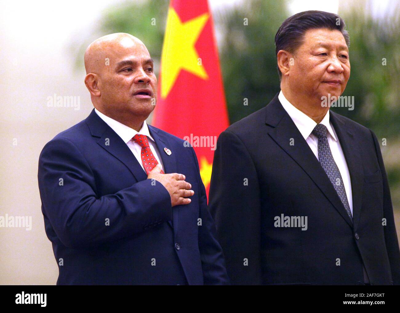 Beijing, China. 13th Dec, 2019. Micronesian President David Panuelo (L) and Chinese President Xi Jinping attend a welcoming ceremony at the Great Hall of the People in Beijing on Friday, December 13, 2019. Paneulo's visit to China highlights Beijing's growing interest in countering the U.S.'s geopolitical and military dominance in the region by using 'checkbook diplomacy' to gain inroads to the island nations. Photo by Stephen Shaver/UPI Credit: UPI/Alamy Live News Stock Photo