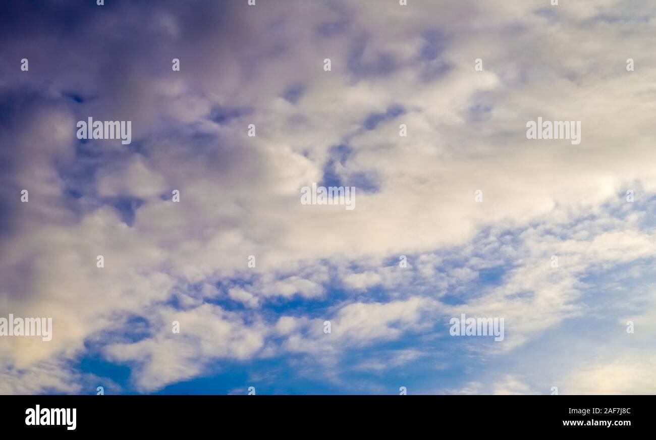 Beautiful fluffy clouds on a deep blue sky Stock Photo - Alamy