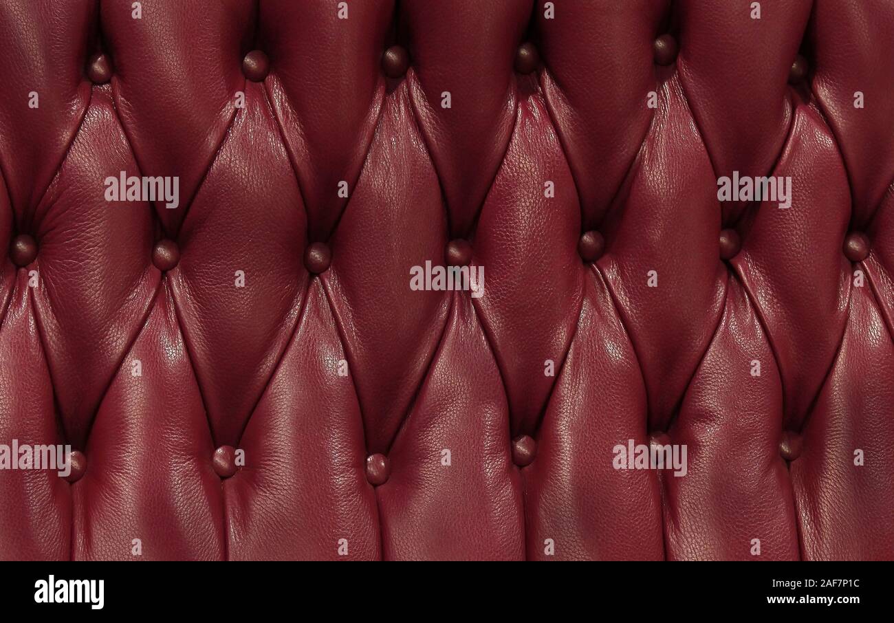Dark burgundy cherry red upholstery pattern background Stock Photo