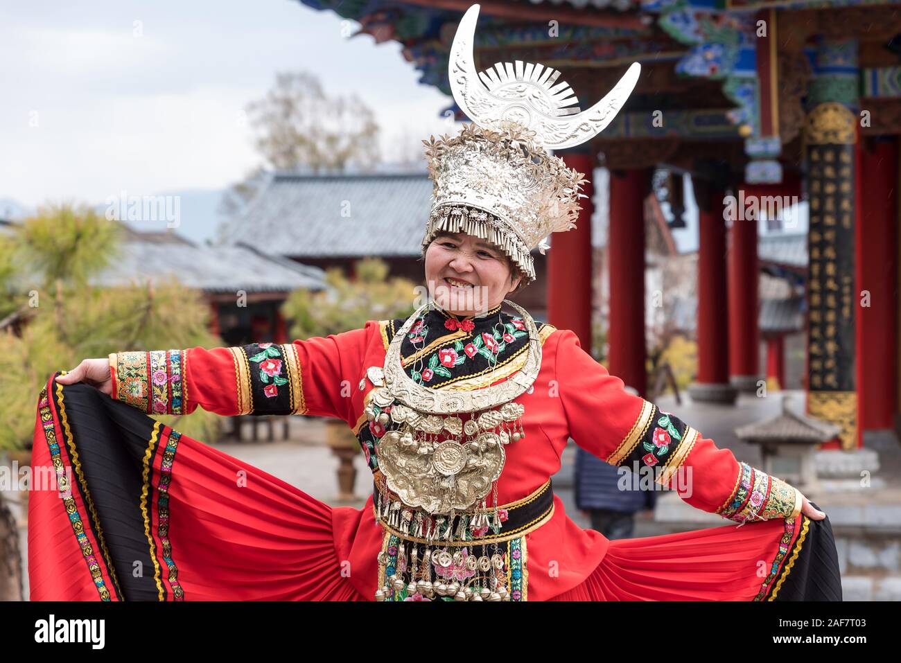 March, 16. 2019: Woman wearing costume of a Yunnan Minority. Lijiang, Yunnan Province, China. Stock Photo