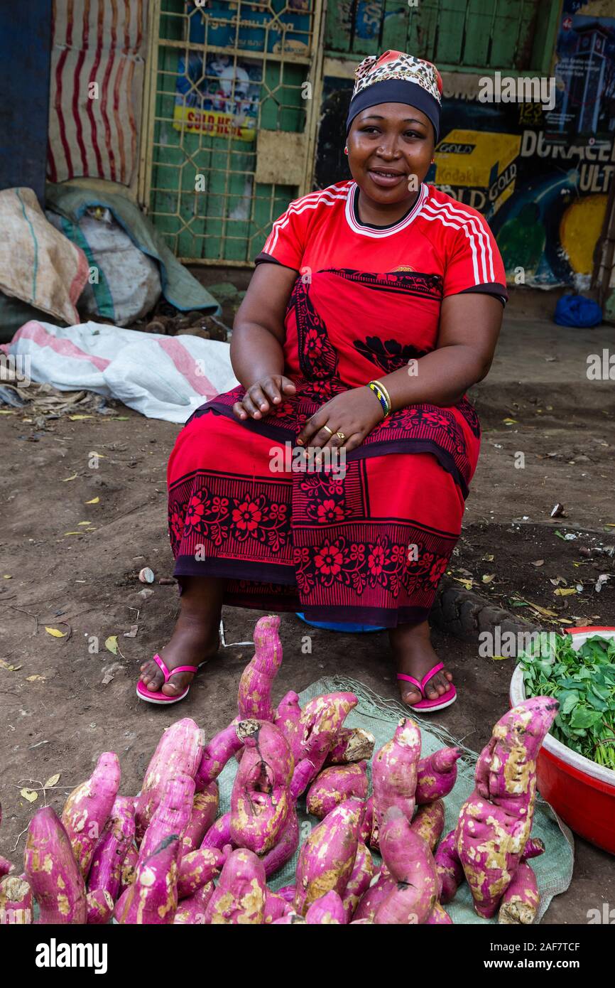 Tanzania.  Mto wa Mbu. Woman Selling Sweet Potatoes in the Market. Stock Photo