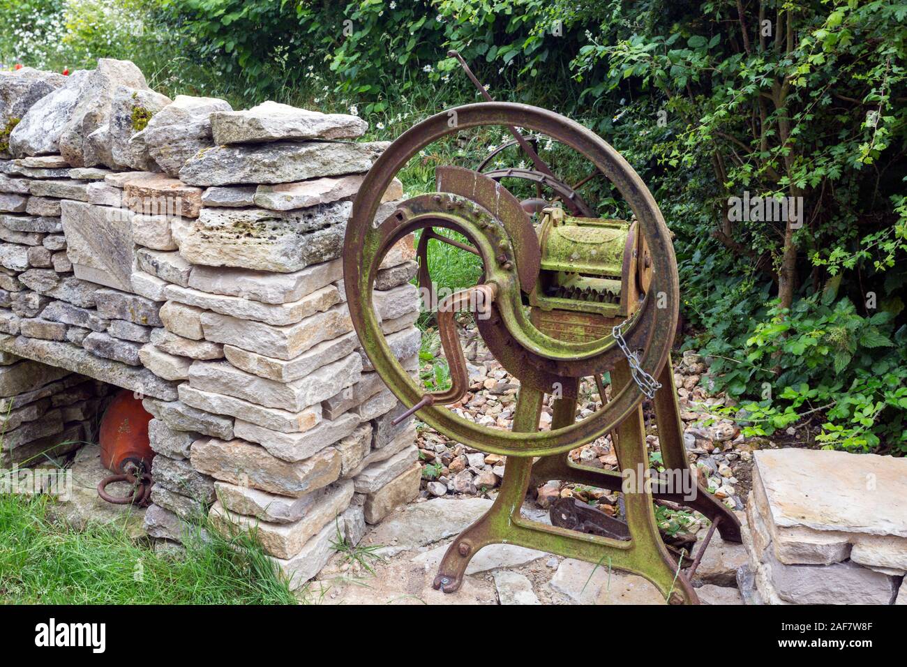A preserved chaff cutter on the restored farm in the abandoned village ...