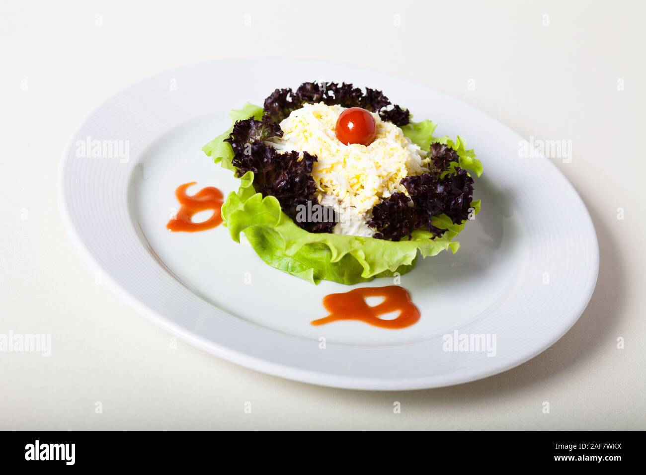 Salad with shredded cheese topping Stock Photo Alamy
