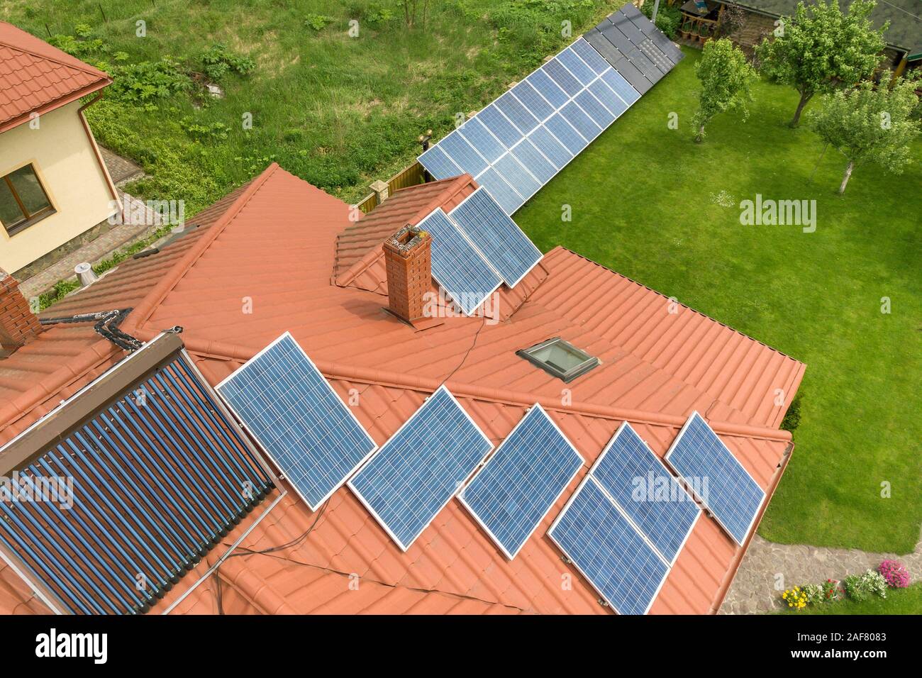Aerial view of a new autonomous house with solar panels and water ...