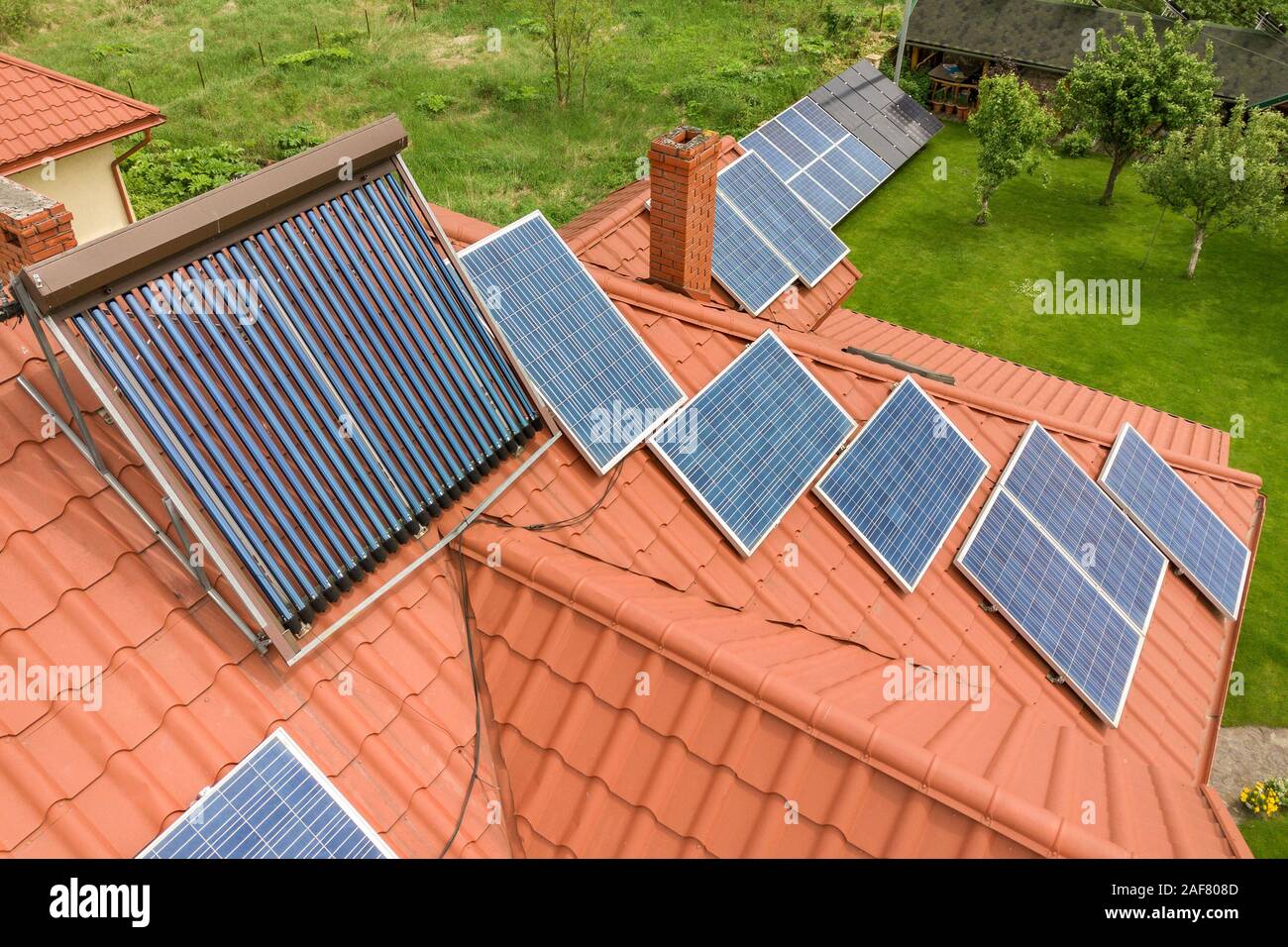 Aerial view of a new autonomous house with solar panels and water ...