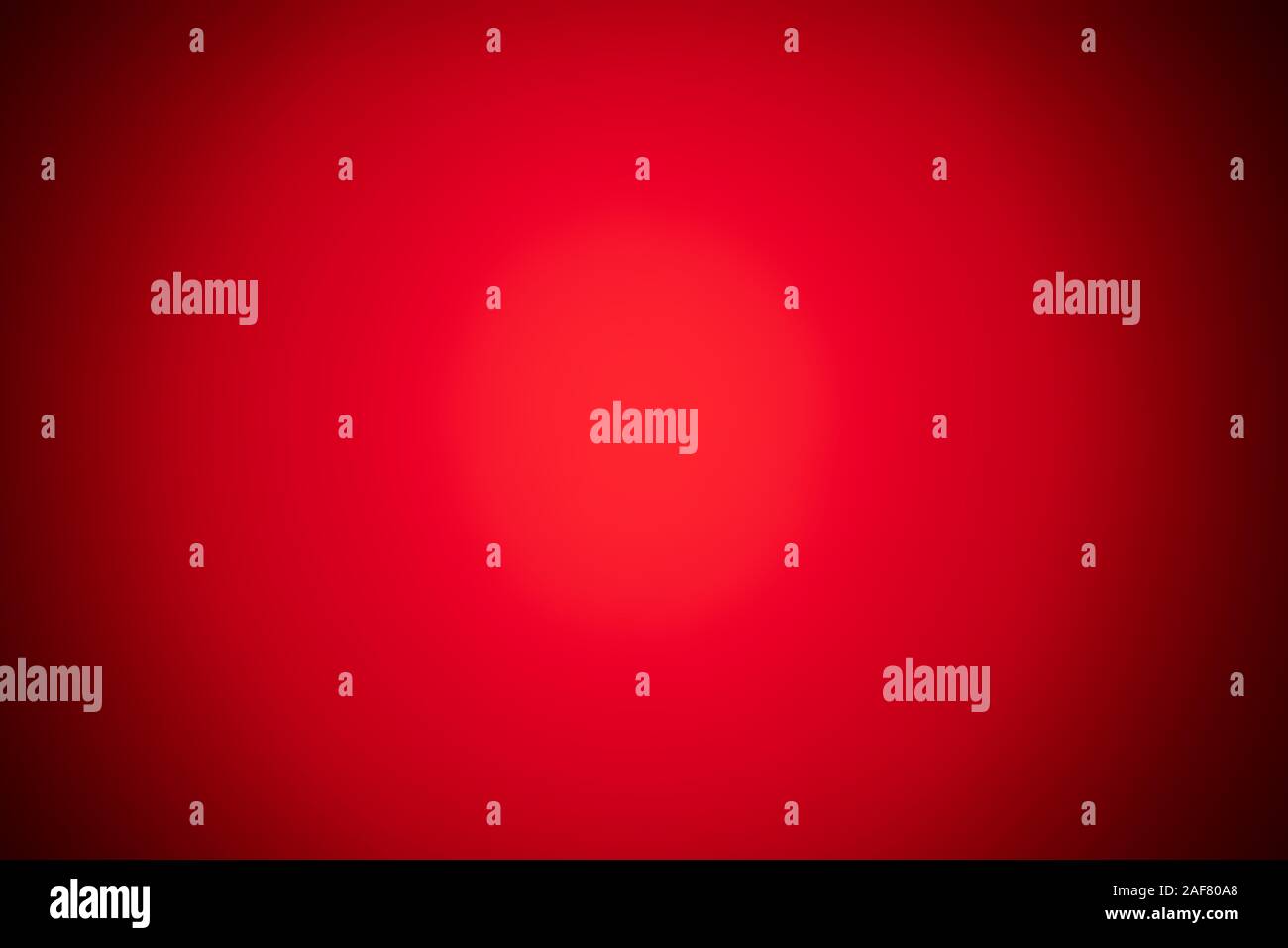 red blurred background with strong black gradient and vignette. Stock Photo