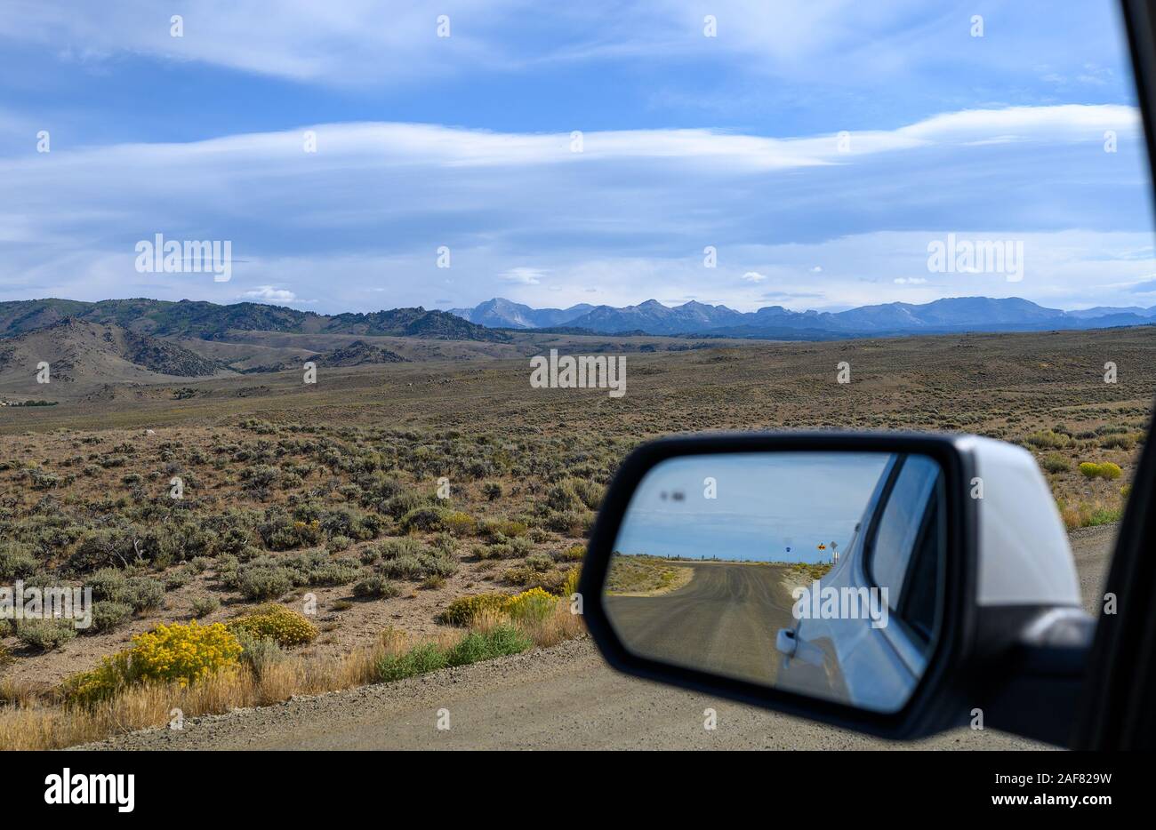 Wide open space on drive near Pinedale, Wyoming with the Wind River Mountains in the distance. Stock Photo