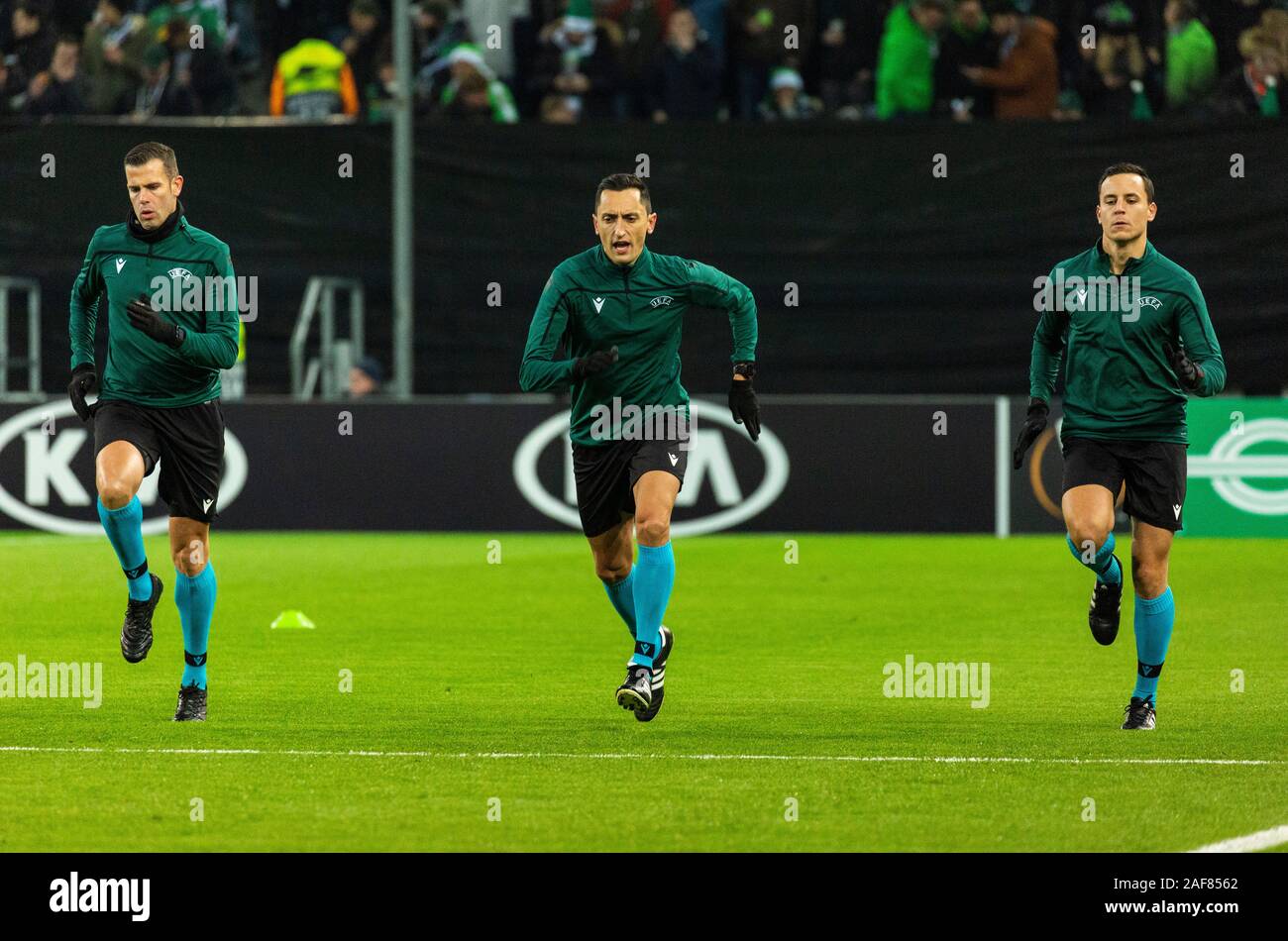 sports, football, UEFA Europe League, 2019/2020, Group Stage, Group J, Matchday 6, Borussia Moenchengladbach vs. Istanbul Basaksehir FK 1-2, Stadium Borussia Park, match officials, referee Jose Maria Sanchez Martinez from Spain (middle) with assistants Raul Cabanero Martinez and Inigo Prieto Lopez de Cerain Stock Photo