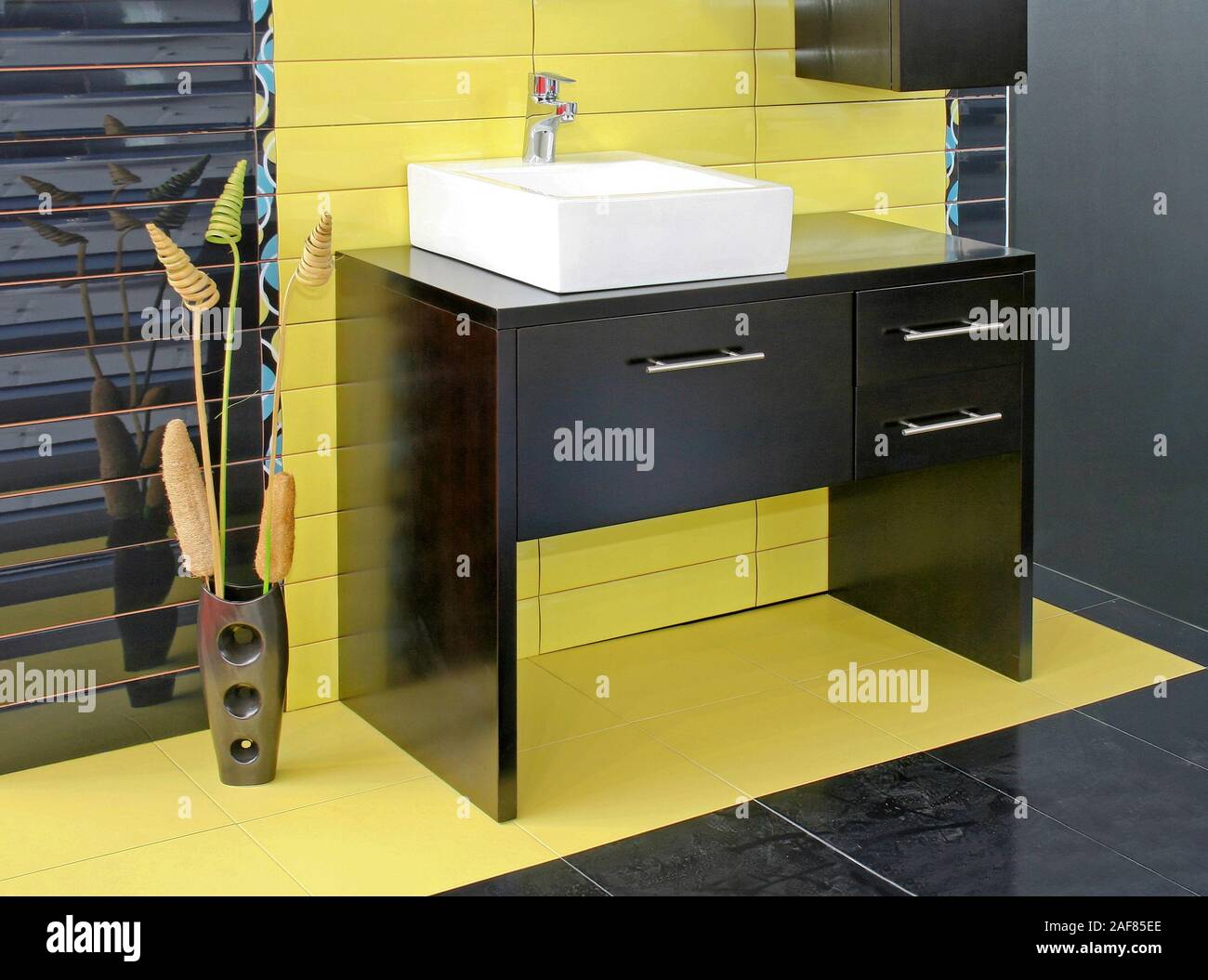 Black wooden bathroom furniture with green ceramics Stock Photo Alamy