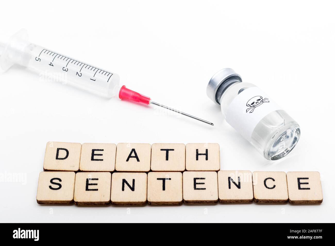 A glass medical vial with a skull and crossbones on a white background