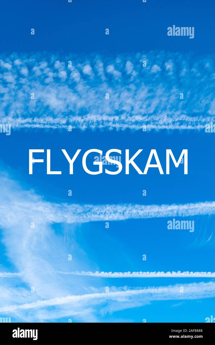 Climate change and flygskam concept image with blue sky and vapour trails from aircraft with the word flygskam (Swedish for flying shame) Stock Photo