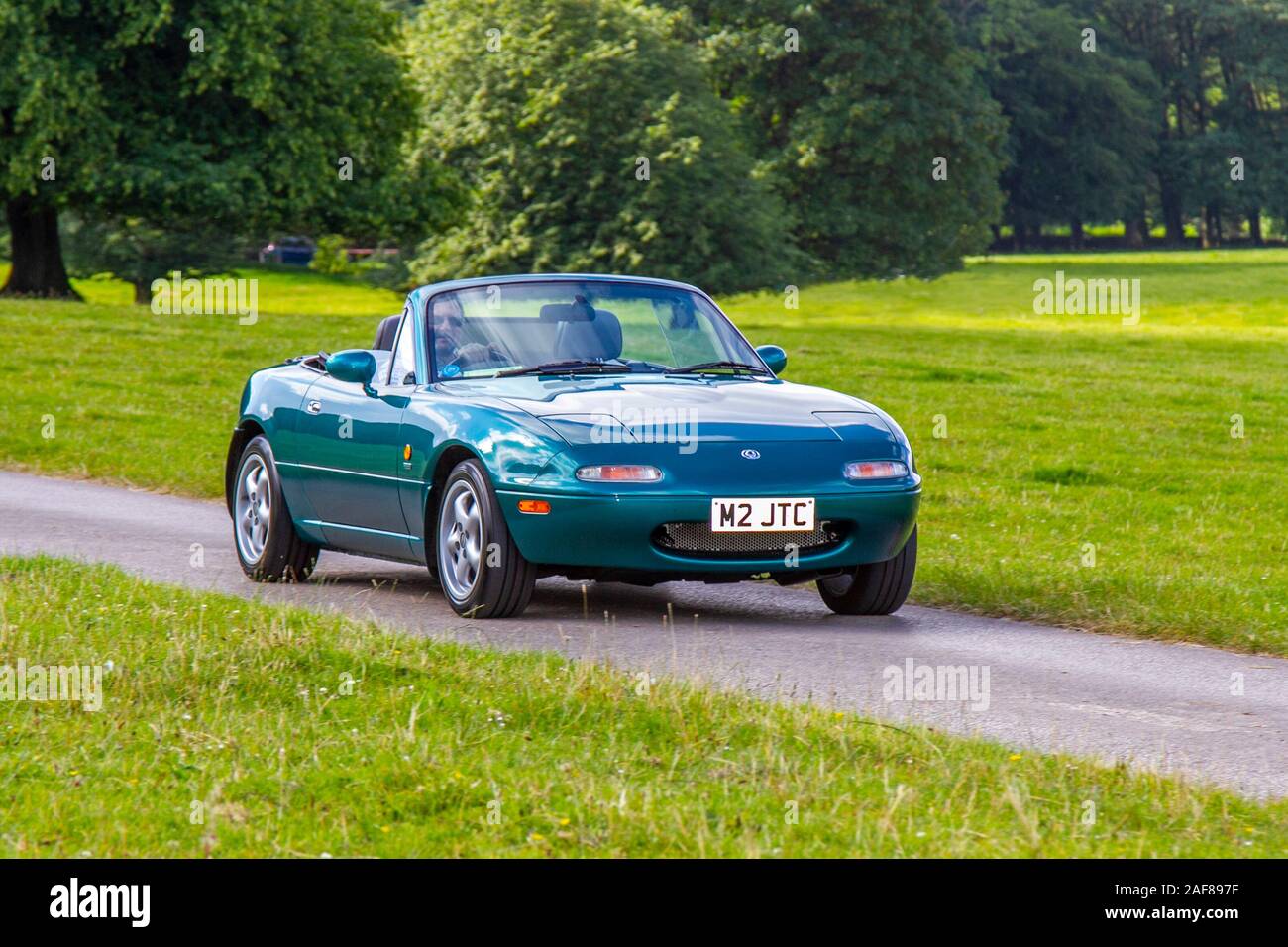 1998 90s green Mazda Mx-5 Berkeley; Classic cars, historics, cherished, old timers, collectable restored vintage veteran, heritage vehicles of yesteryear arriving for the Mark Woodward historical motoring event at Leighton Hall, Carnforth, UK Stock Photo