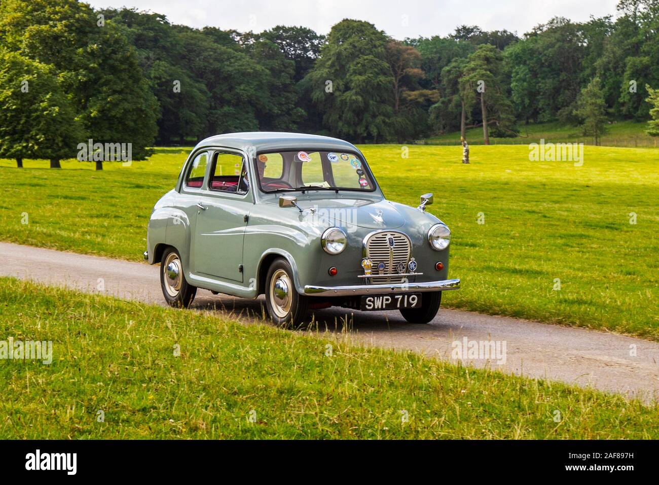 1957 50s fifties grey Austin A35;  Classic cars, historics, cherished, old timers, collectable restored vintage veteran, heritage vehicles of yesteryear arriving for the Mark Woodward historical motoring event at Leighton Hall, Carnforth, UK Stock Photo