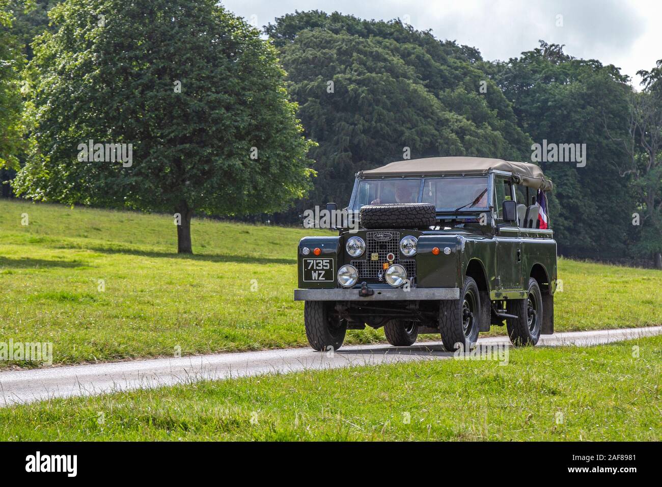 1969 60s sixties Series IIA green Land Rover; Classic cars, historic, cherished, old timers, collectable restored vintage veteran, heritage vehicles of yesteryear arriving for the Mark Woodward historical motoring event at Leighton Hall, Carnforth, UK Stock Photo