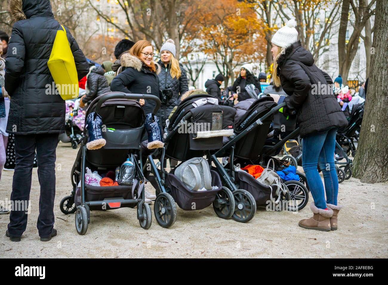 It’s stroller gridlock at the Madison Square Park tree lighting in New York on Thursday, December 5, 2019. Hundreds of nannies and mother brought out their children to enjoy the tree lighting ceremony in the park. (© Richard B. Levine) Stock Photo