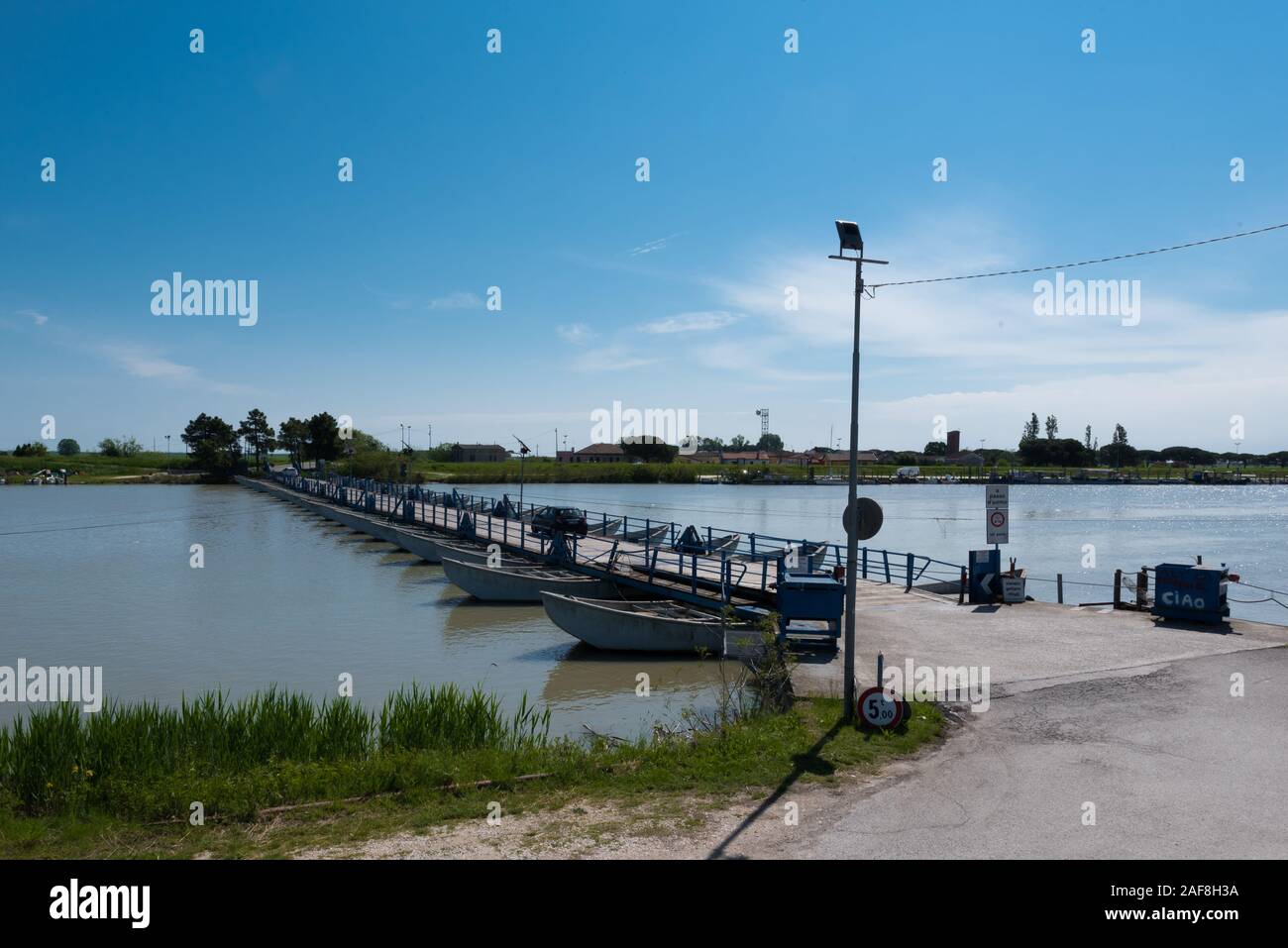 Bridge made from boats over a canal in the Po Delta Stock Photo