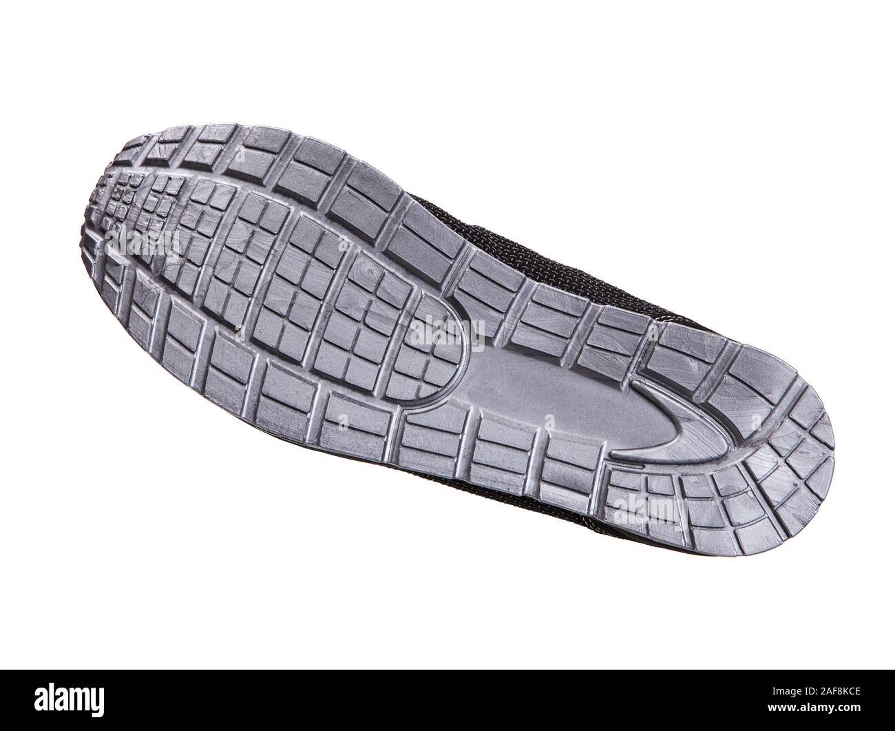 The sole of a modern sneaker is gray. Sports shoes isolate on a white background. Stock Photo