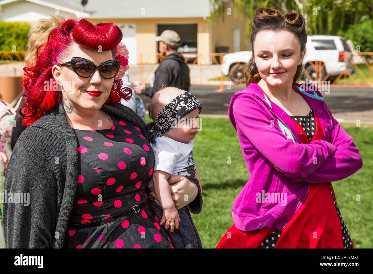A mother and daughter dressed in 1950's period outfits and sporting period coiffures at the Moab April Action Car Show in Moab, Utah.  The elder woman Stock Photo
