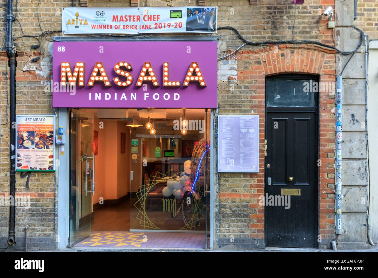 Masala Indian Food Restaurant, Curry House exterior in Brick Lane, Tower Hamlets, East End of London, UK Stock Photo
