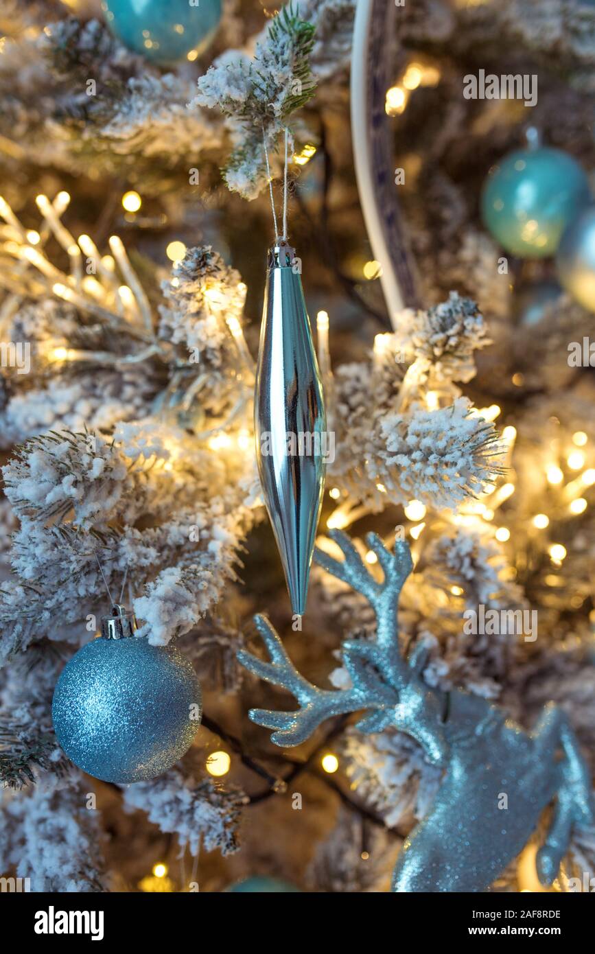 beautiful blue and silver christmas decorations on christmas tree on  garland background Stock Photo - Alamy, image size:867x1390