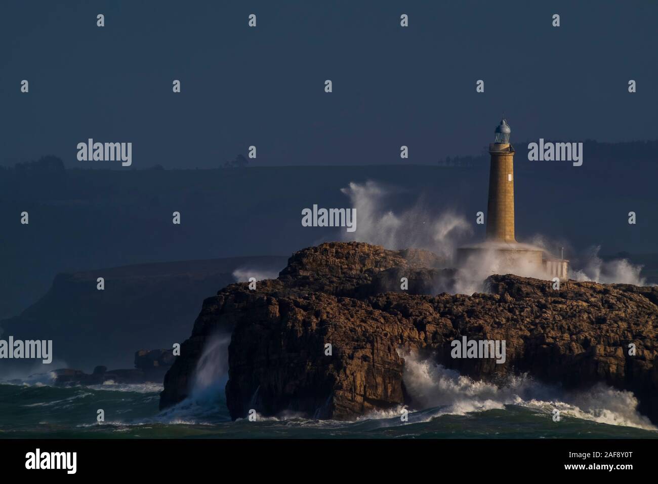 Mouro island lighthouse. Big waves and winter storm- Stock Photo