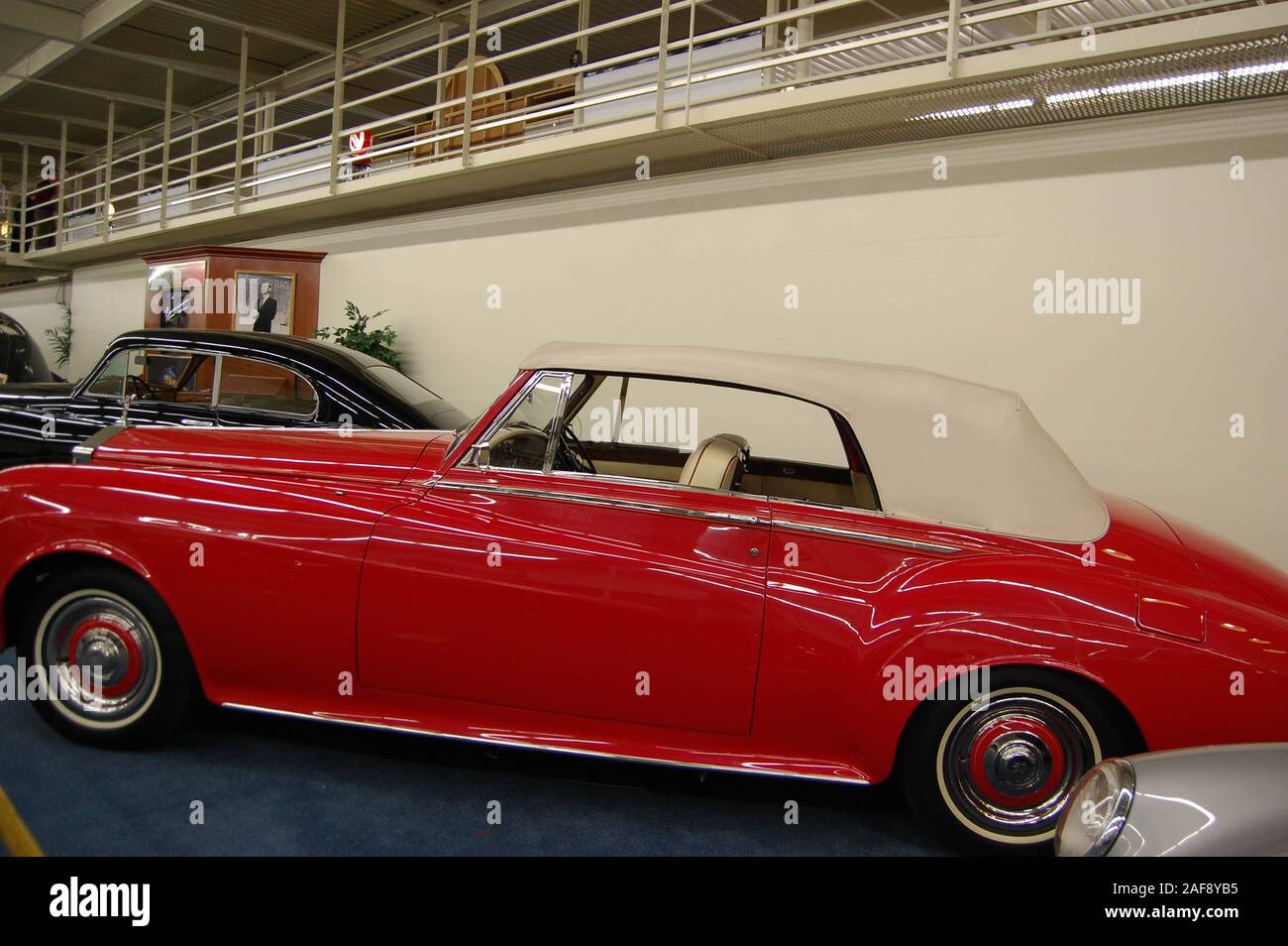 Red Rolls Royce with white roof in a classic car museum Las Vegas