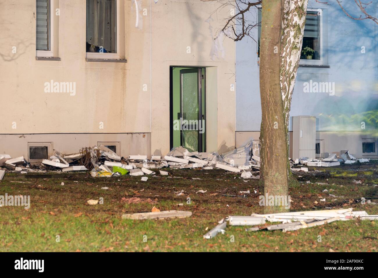 Blankenburg, Germany. 13th Dec, 2019. In front of the door of a multiple dwelling in Blankenburg in the Harz lies rubble after a heavy explosion. A 78-year-old man died in the accident, and several people were injured, some of them seriously. According to police, the dead man had heated his apartment with propane gas, which was forbidden. The explosion was probably caused by a technical error or improper condition. Credit: Mattis Kaminer/Alamy Live News Stock Photo