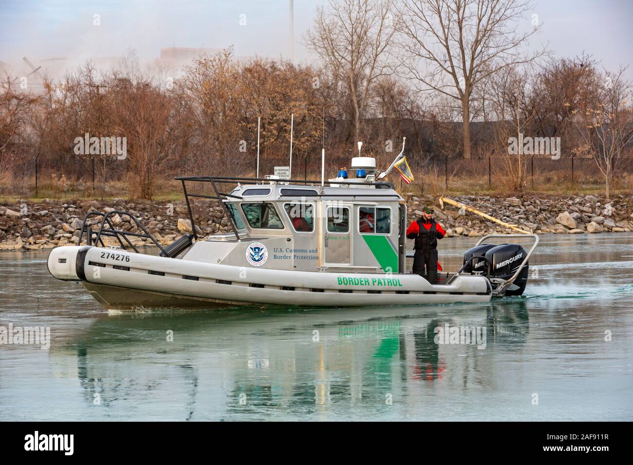 Detroit, Michigan - A U.S. Border Patrol boat cuts through ice on Conners Creek on its way to patrol the Detroit River between the United States and C Stock Photo