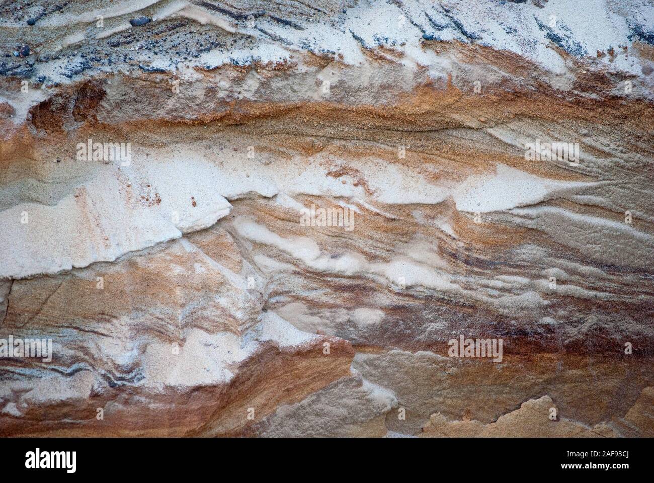Colorful layers of the sand, abstract natural pattern, closeup photo Stock Photo