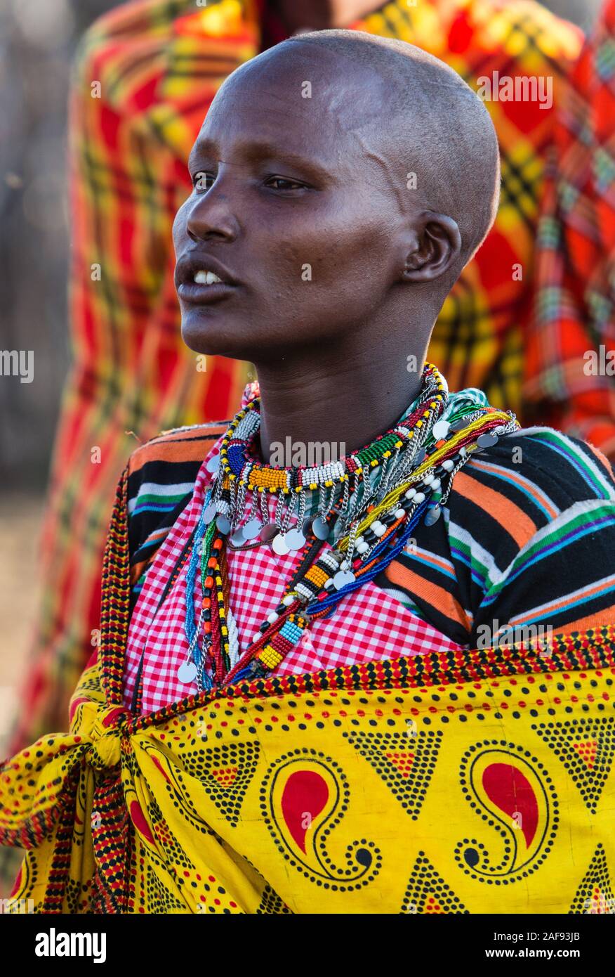 Tanzania Maasai Woman In Traditional Dress Singing To Welcome Visitors Maasai Village Of