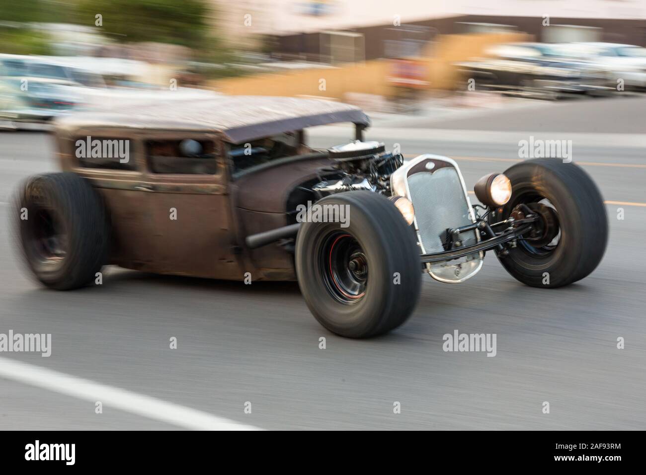 A custom-built 1928 Ford Model A rat rod cruising in the April Action Moab Car Show in Moab, Utah. Stock Photo