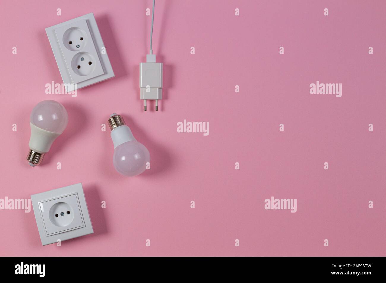 White electrical power sockets, power plugs, light lamp bulbs on light