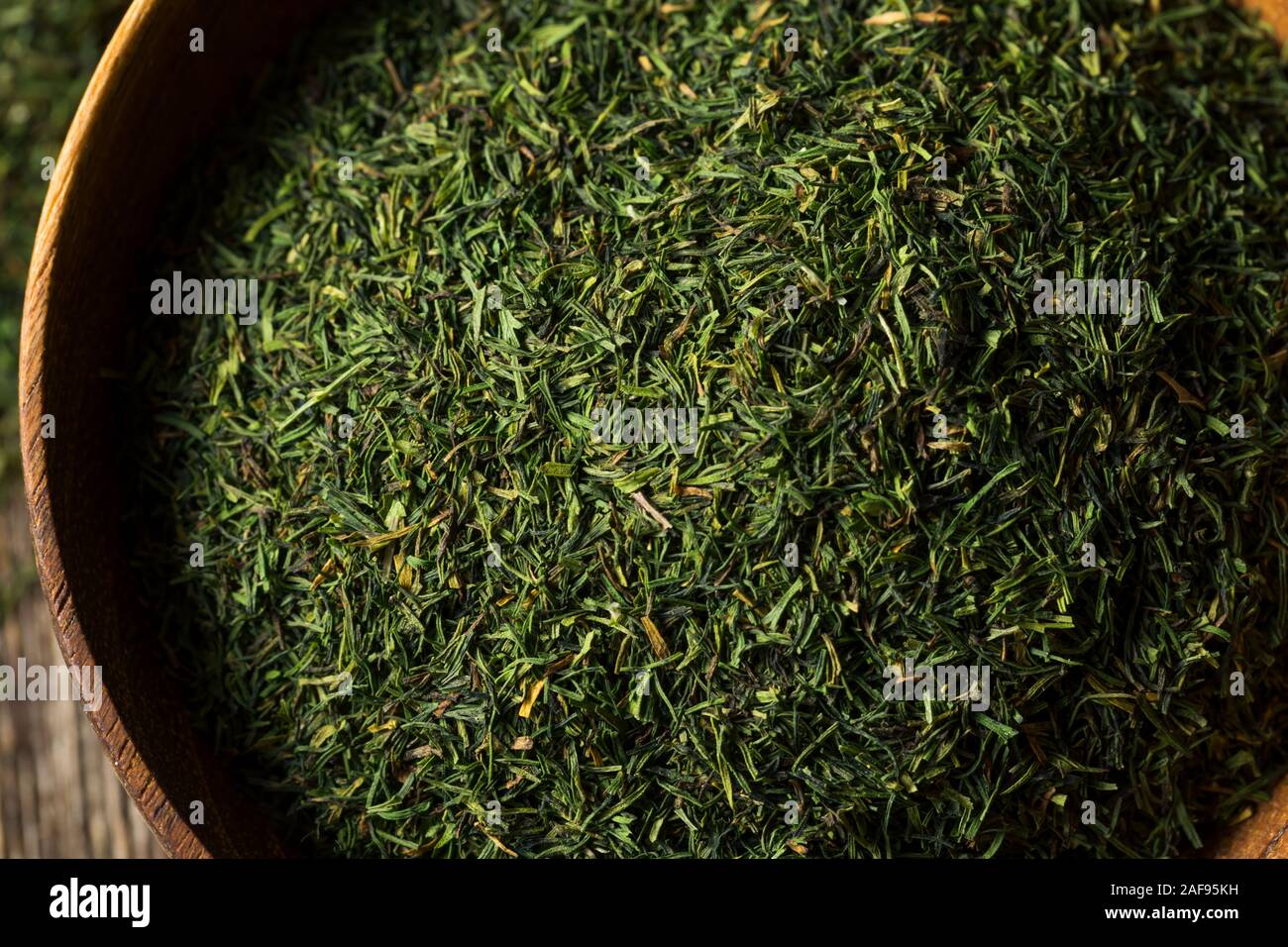 Dried Green Organic Dill Spice in a Bowl Stock Photo