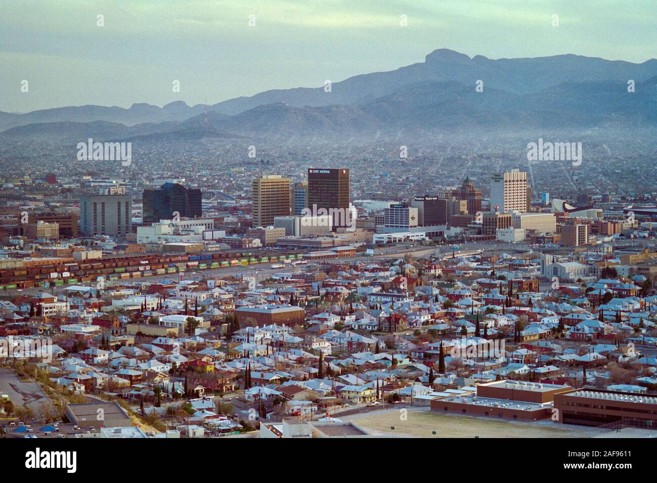 El Paso, Texas, USA - January 1991:  Archival cityscape view of downtown El Paso with Juarez Mexico in background. Stock Photo