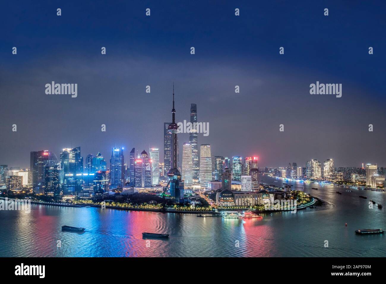 Pudong district and the skyline of Shanghai, China with the Huangpu river and tall skyscrapers Stock Photo