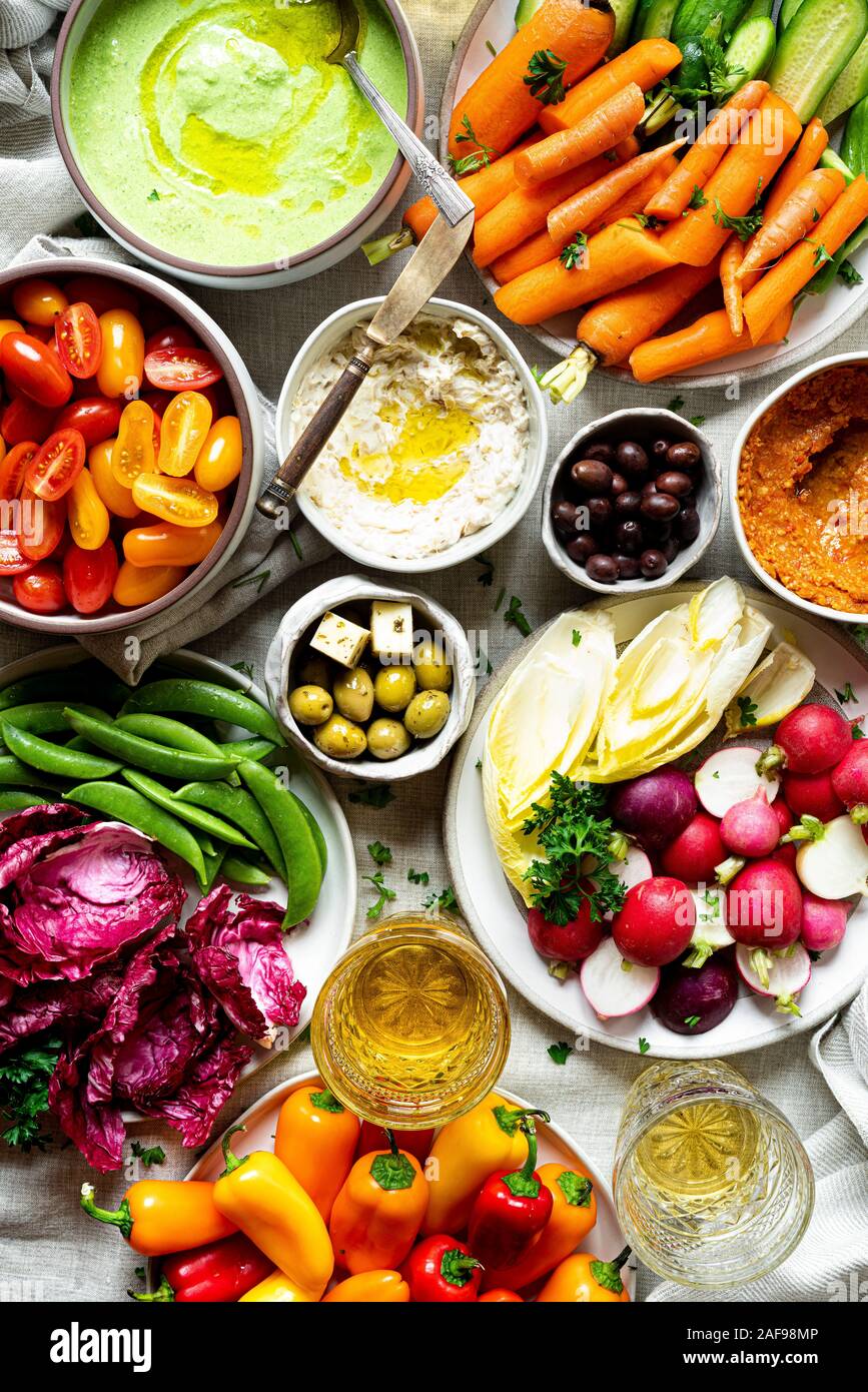 Assorted Raw Vegetable Appetizer Platter with three dips Stock Photo