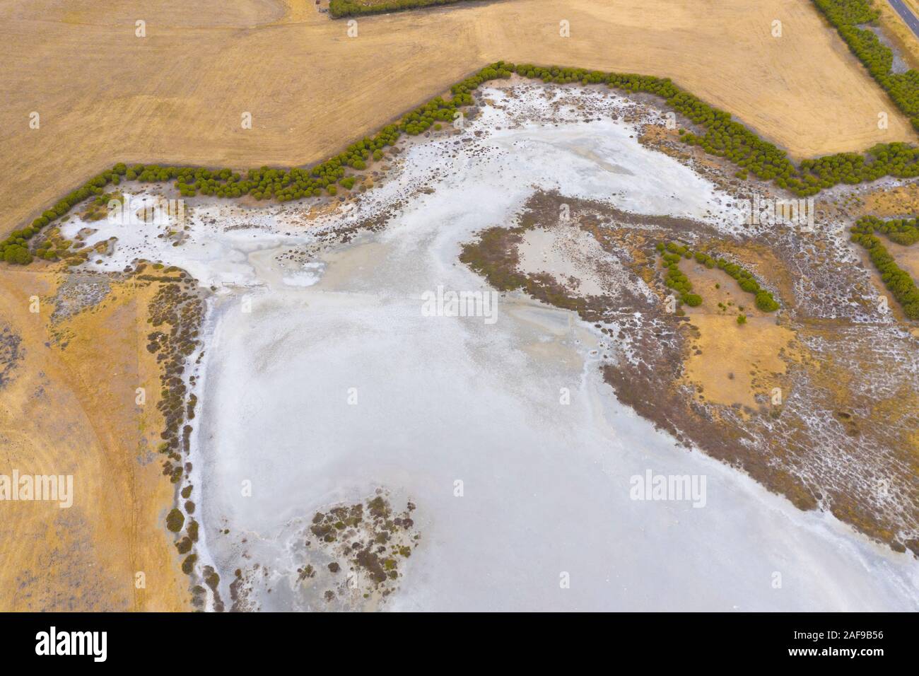 A large fresh water dam on Hindmarsh Island south of Adelaide in Australia that is dry due to