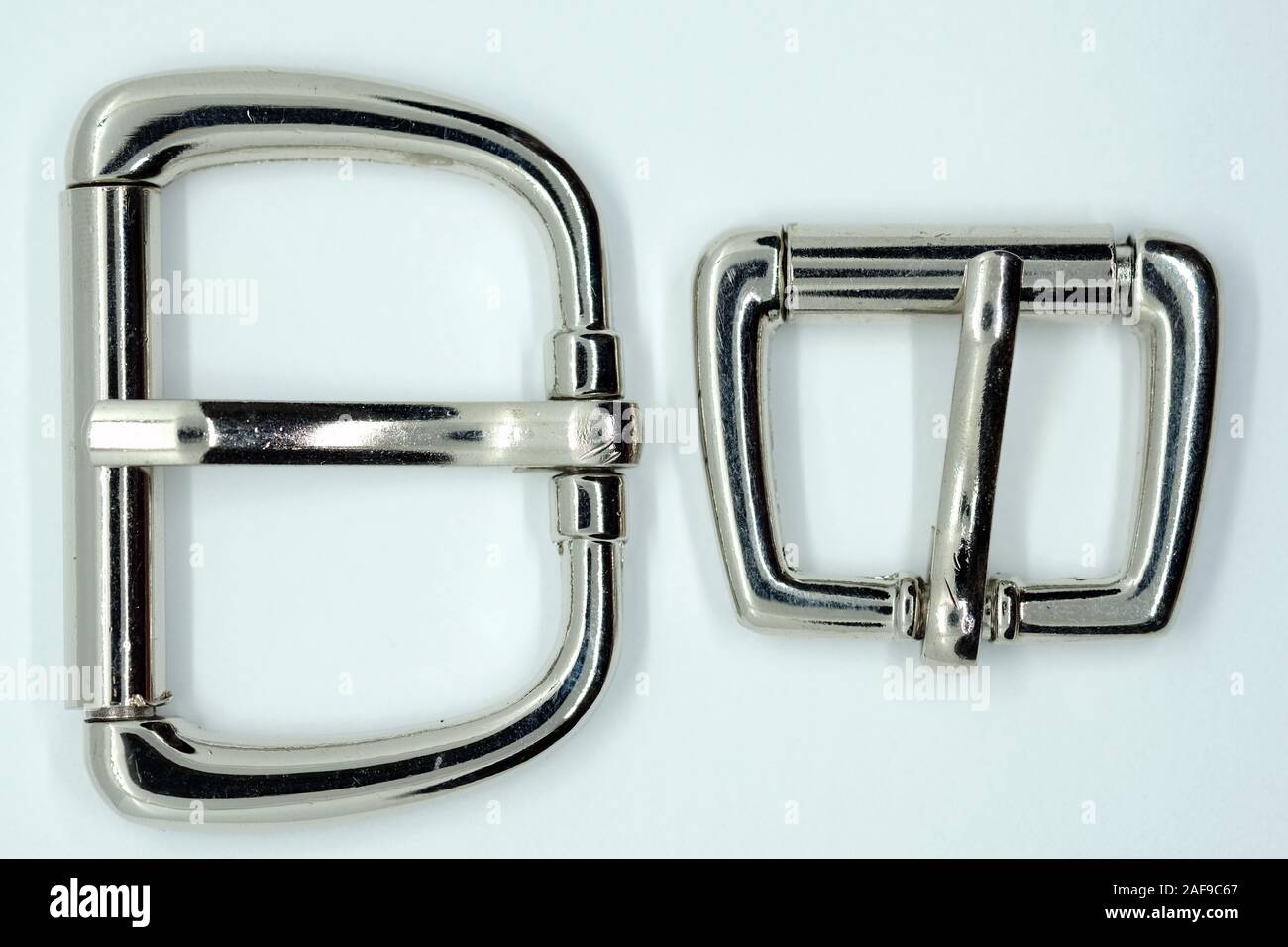 Buckle for dog leash, chrome-plated in the shape of a trapezoid. Silver metal buckle for belts. Accessories for the manufacture of collars and straps Stock Photo