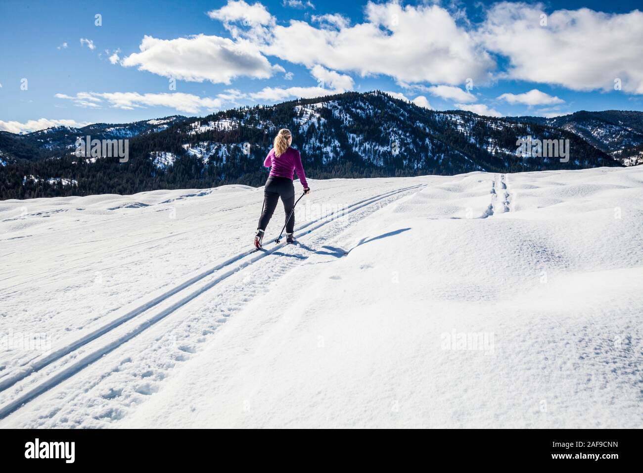 A middle aged woman on the cross country trails in the Methow Valley up