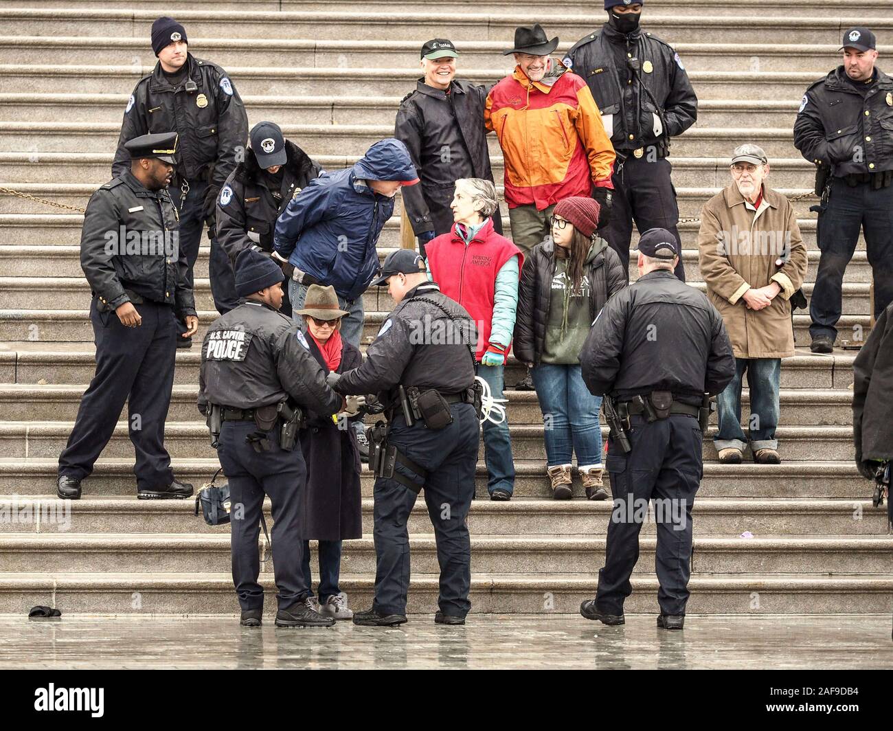 Washington, District of Columbia, USA. 13th Dec, 2019. Surrounding by police, SALLY FIELD is arrested for civil disobedience at Fonda's Fire Drill Fridays climate change march on the steps of the US Capitol on Fire Drill Friday. Credit: Sue Dorfman/ZUMA Wire/Alamy Live News Stock Photo