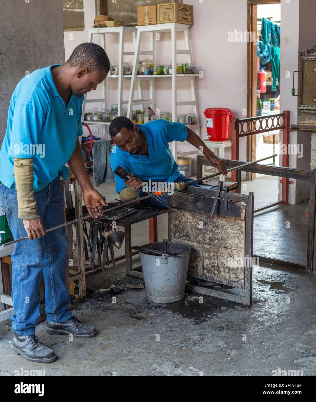 Arusha, Tanzania.  Artisan Working with Molten Glass at Shanga, a Handicraft Center Employing the Handicapped. Stock Photo