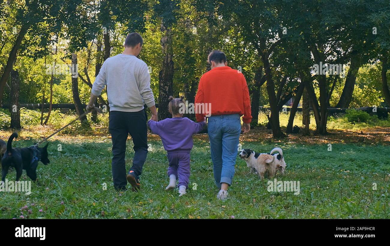 Mom and daughter walking dog hi-res stock photography and images - Alamy