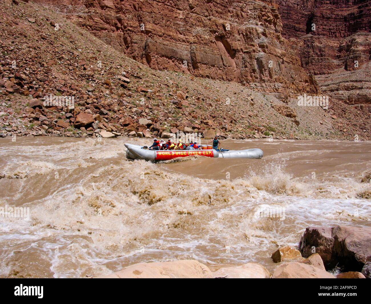 A 33' Srig raft navigates through the Big Drop II rapid in Cataract