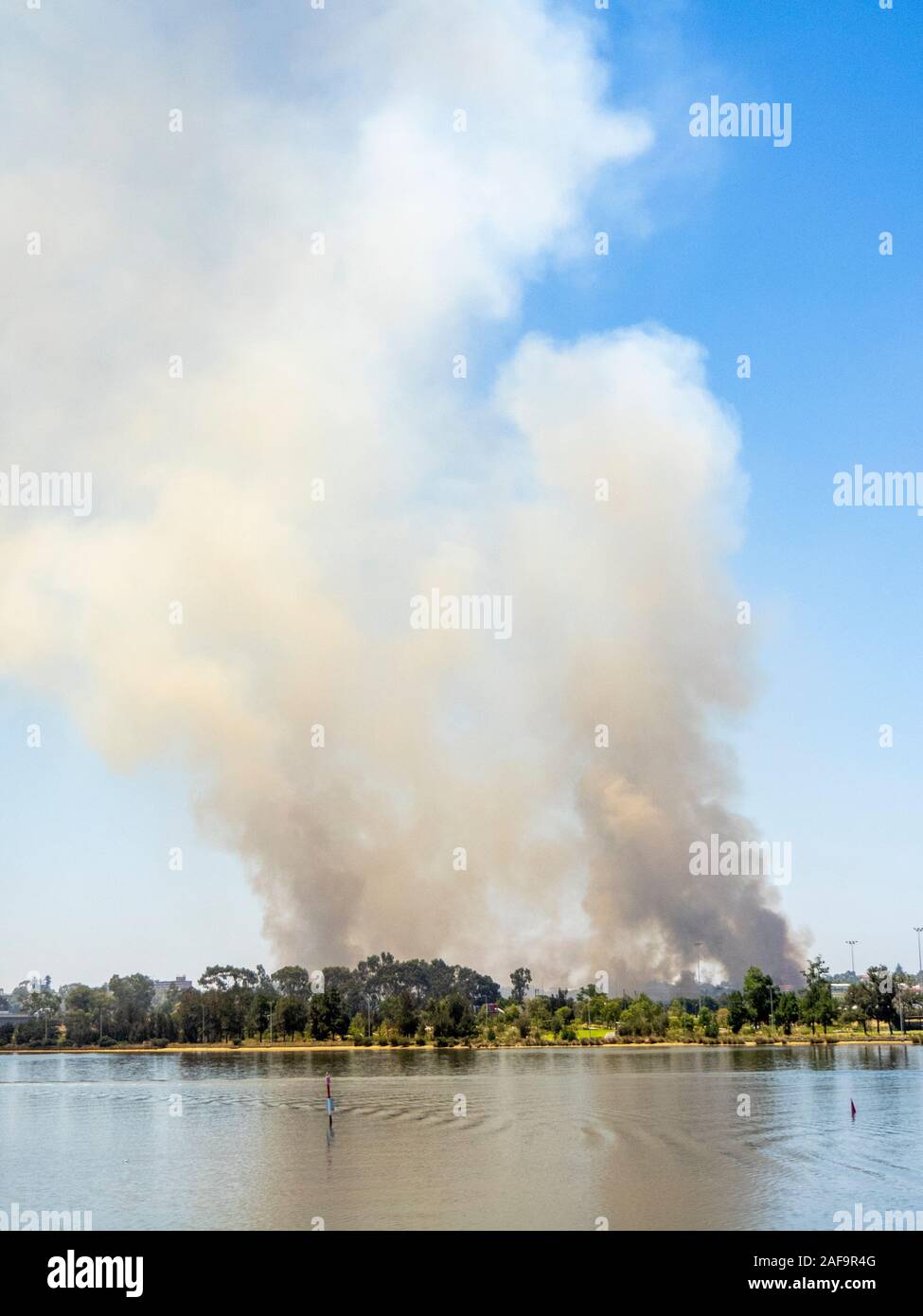 Smoke from a bushfire in Belmont alongside the Swan River Perth Western ...
