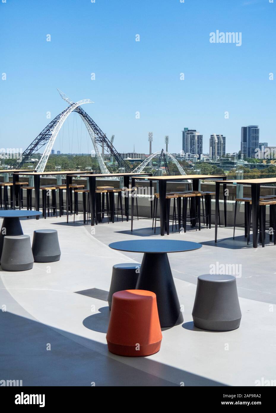 Alfresco bar tables and chairs at Optus Stadium overlooking Matagarup