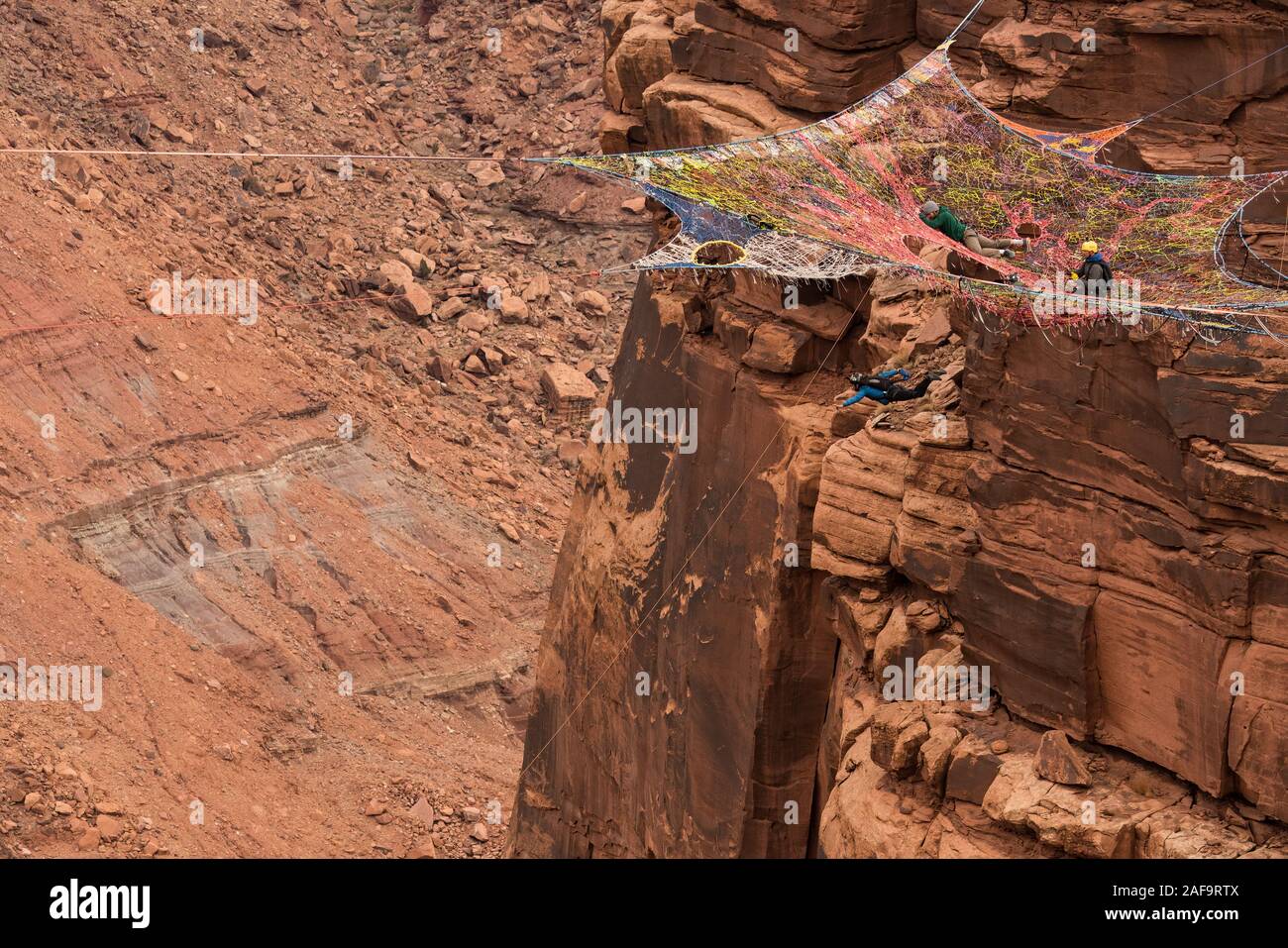 A female BASE jumper leaps from the Mothership suspended from the cliffs 950 vertical