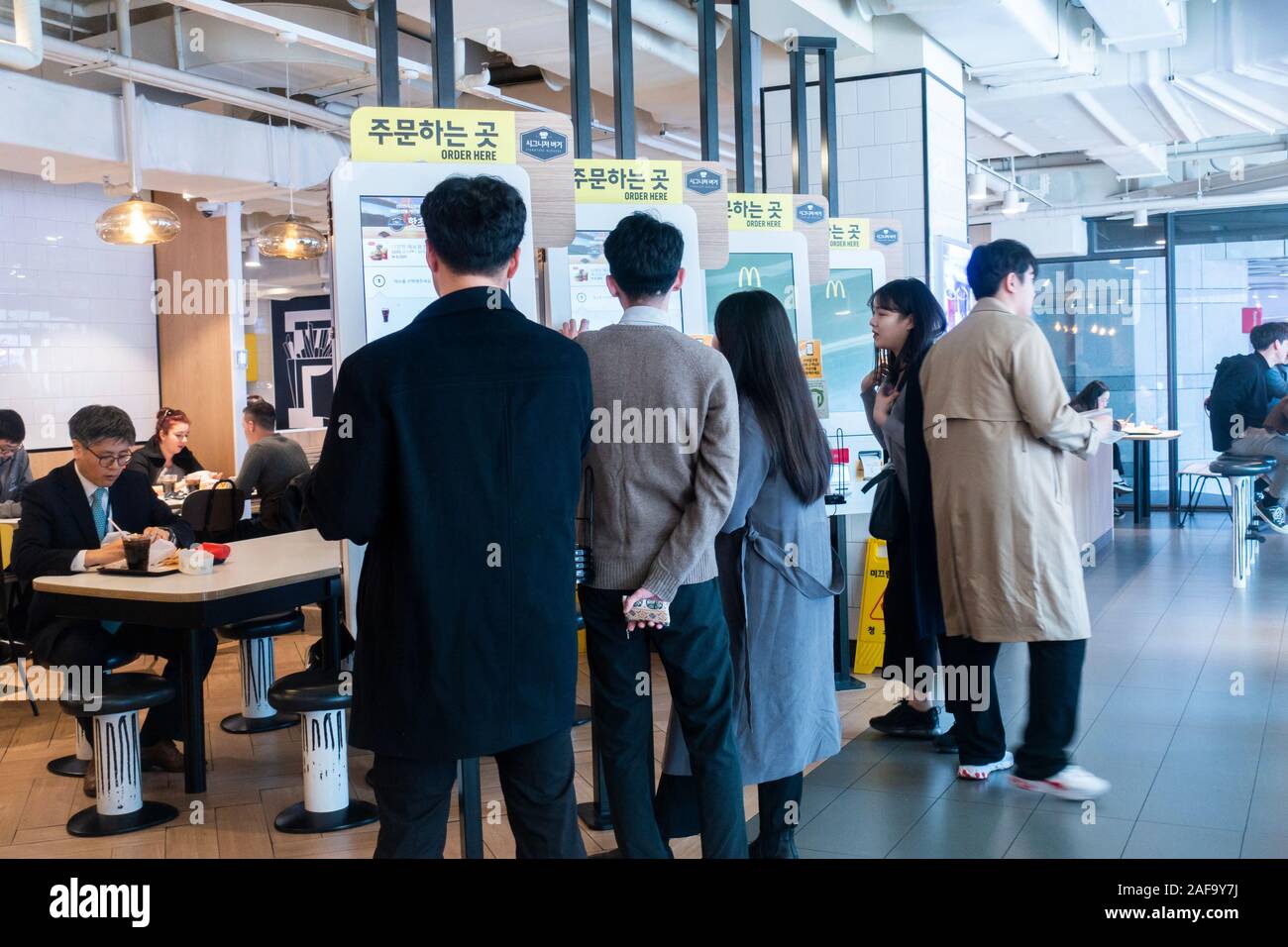 Seoul, South Korea, December 2019: People ordering food in McDonald Stock Photo